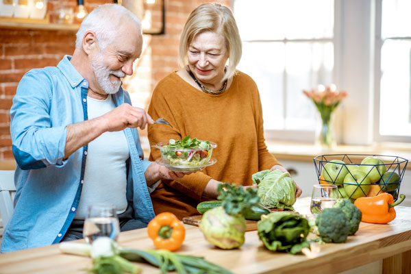 Cheerful Senior Couple Eating Healthy